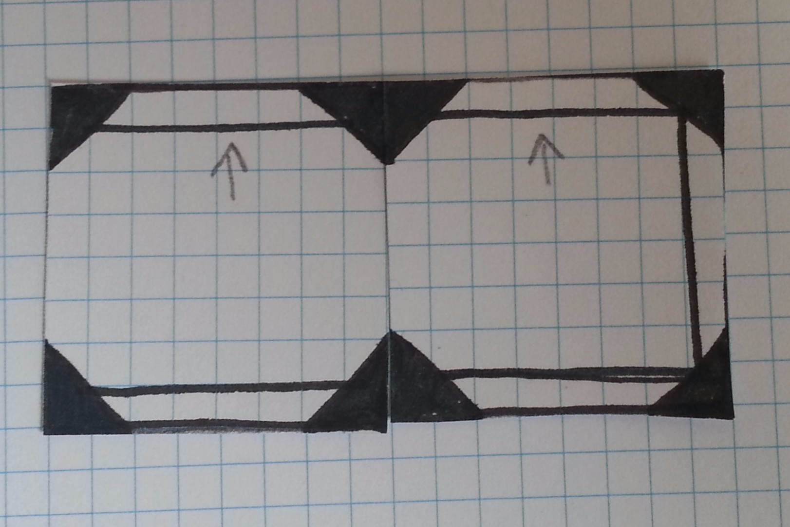 Two tiles can be arranged to create a very simple corridor. The arrows on the paper simply indicate which direction is "up" so tiles can be differentiated.